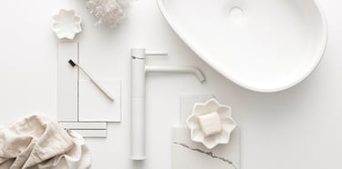 Product photography - a sink with a tap and tiles styled on a white table