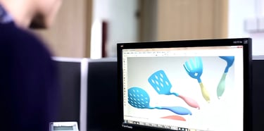 Designer showing his design work in front of computer
