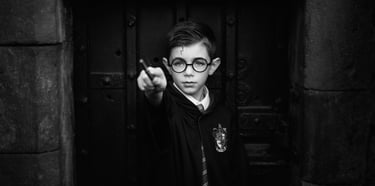 a young boy in a harry potter potter potter costume