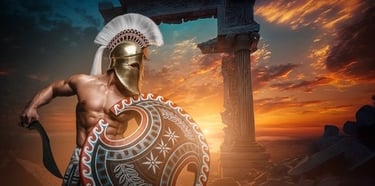 Spartan warrior in golden helmet and shield standing before ancient Greek ruins at sunset.