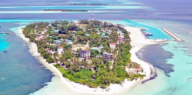 Dhangethi Island Maldives with white sandy beaches, clear waters, snorkeling, and local island life.