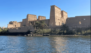 Aswan cityscape showcasing temples, the Nile, and the High Dam.