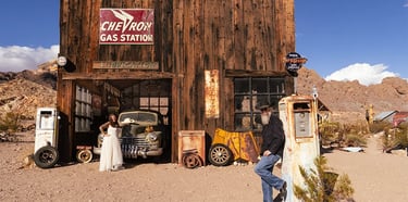 a man standing in front of a building with a woman standing next to it