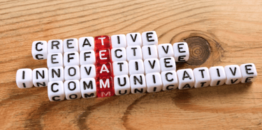 a group of words spelling team, including creative, effective, innovative and communicate