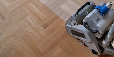Sanding hardwood floors with belt sander
