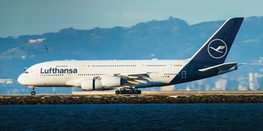 A Lufthansa aircraft parked near a body of water