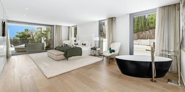 Contemporary designer suite at Villa Serenity, featuring clean lines and a soft, neutral palette