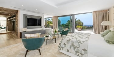 Elegant suite with seating and terrace at Villa Serenity