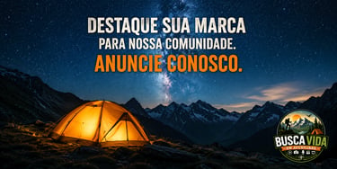 A glowing tent at night under the Milky Way for outdoor advertising with Busca Vida em Aventuras.