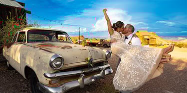 a bride and groom are posing for a photo
