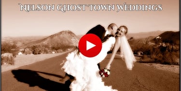 A bride and groom embrace for a Nelson Ghost Town wedding video in the Nevada desert.