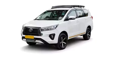 White Toyota Innova Crysta one way taxi by Saini taxi services with a luggage carrier rack