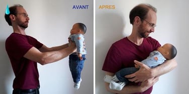 père portant son bébé dans les bras
