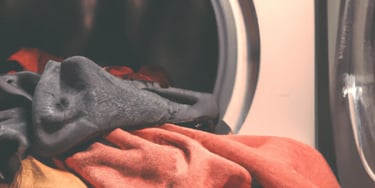 a pile of clothes in a washing machine