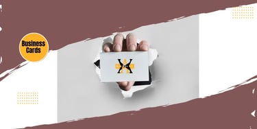 a person's Hand holding a business card
