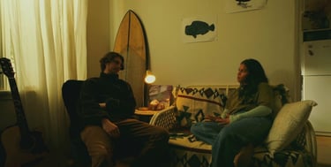 a man and woman sitting on a couch
