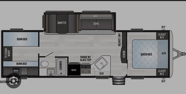 a floor plan of a travel trailer with a living room and kitchen