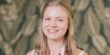 a woman in a striped shirt and jeans