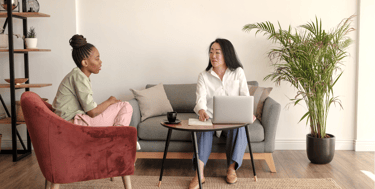a business woman supporting a client with their financials for benefit paperwork