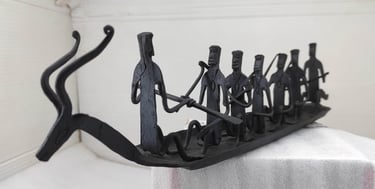 "Traditional Bastar forged iron boat with seven figures and deer head – left side view-Meant for export"