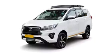 White Toyota Innova Crysta one way taxi by Saini taxi services with a luggage carrier rack