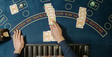 gaming table at casino party with dealer's hands from overhead