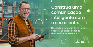 a man in a vest and glasses holding a cell phone