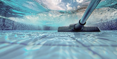 Underwater view of pool vacuum head in action, capturing crystal-clear water and deep cleaning— Piscus Pools