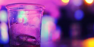 a glass of soda on a table
