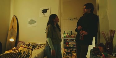 a man and woman standing in a living room