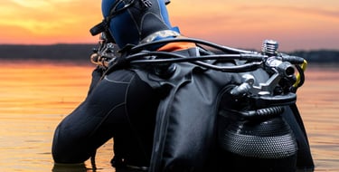a person in a wetsuit with a scuba suit