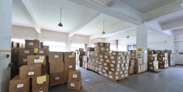 Goods are neatly arranged on the shelves in the factory warehouse, with clear labels