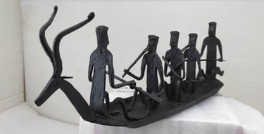 "Handcrafted tribal iron boat with 5 seated figures – Bastar Loha Shilp, left side view-Export-grade"