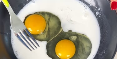 Whisk the eggs with the almond milk