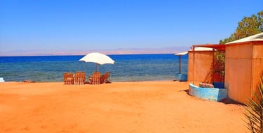 Bedouin star beach with chairs and umbrellas on the sand
