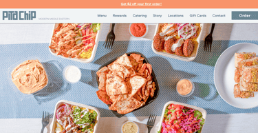 A website showing a flatlay of Middle Eastern food