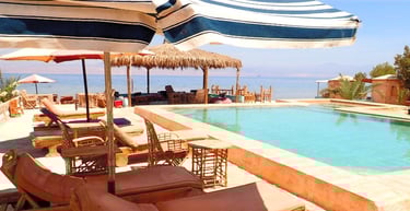 Bedouin star ras shitan lounging under the umbrella