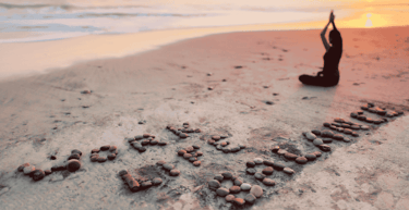 a person sitting on a beach 