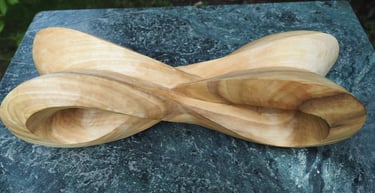 'Infinity Mobius' - abstract sculpture in tulip wood. by Sarah Liptrot