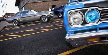 Classic American muscle cars Plymouth RoadRunner and Ford Mustang in Hull