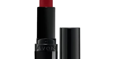 Avon matte red lipstick in a sleek black tube with its cap removed, shown against a white background.