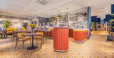 a restaurant with a bar and tables