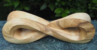 'Infinity Mobius' - abstract sculpture in tulip wood.by Sarah Liptrot