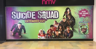a large poster of a suicide squad movie poster