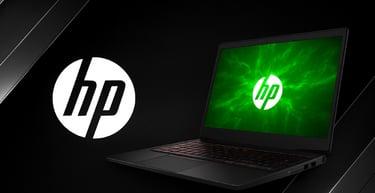 a laptop computer with a green light shining on it