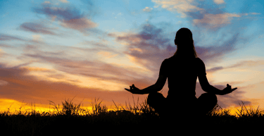 Yoga outdoors at sunrise