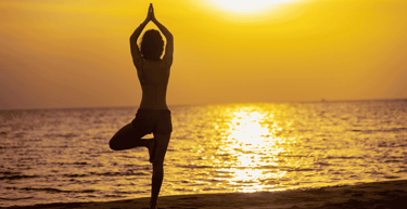Yoga on beach at sunset