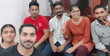 a group of people sitting on a bench
