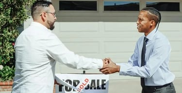 Handshake between professionals representing brand partnerships and market adaptation
