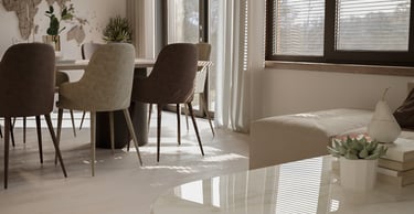 a living room with a table and chairs